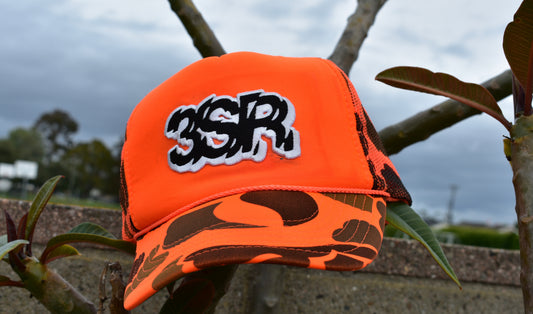 ORANGE CAMO TRUCKER